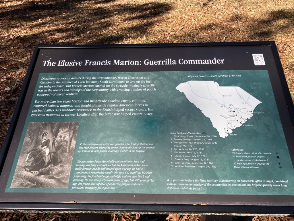 Interpretive sign titled The Elusive Francis Marion: Guerrilla Commander, with a map of South Carolina