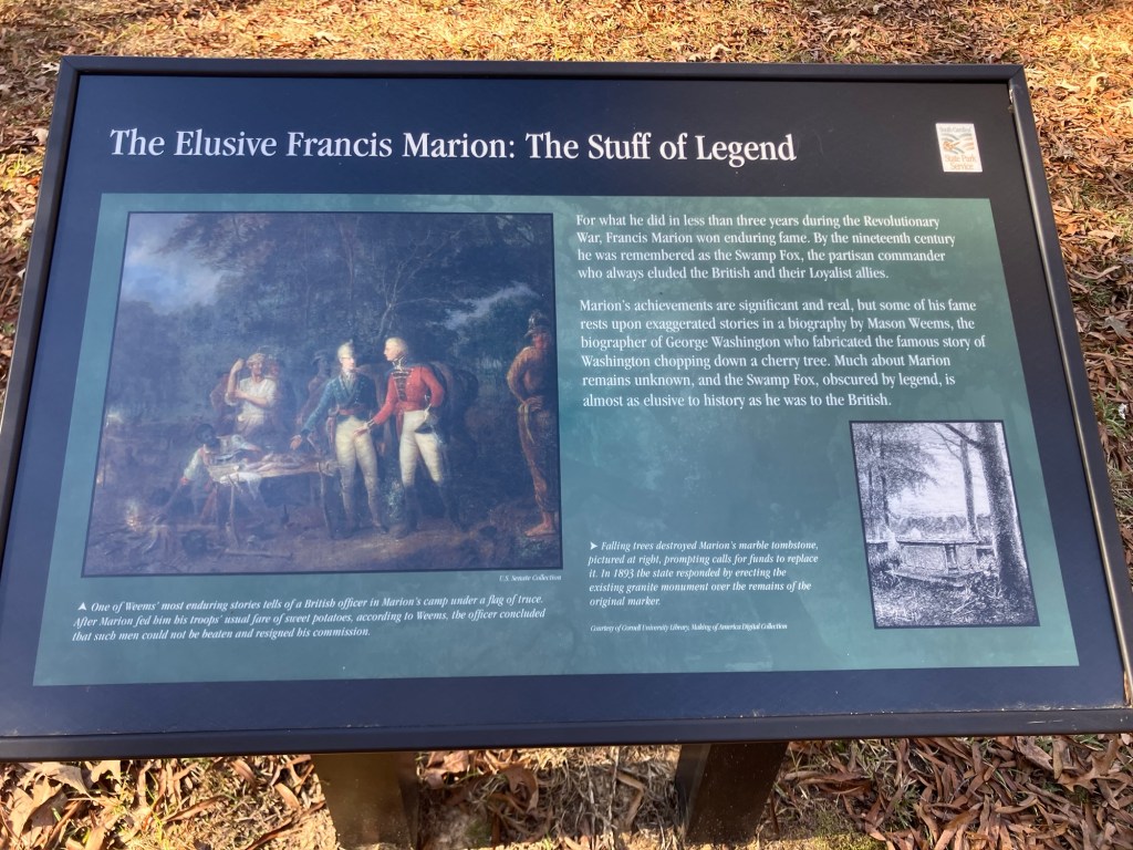 Interpretive sign titled The Elusive Francis Marion: The Stuff of Legend, with a painting of Marion