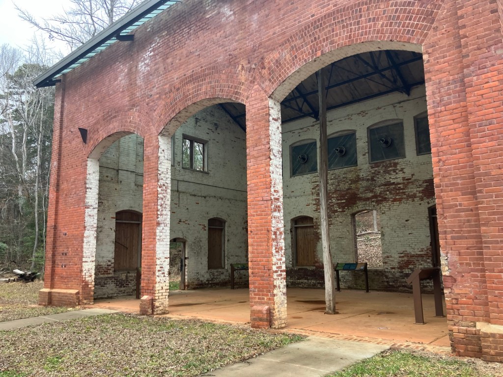 Arched openings in the brick walls of the old Nitrolee Arc Building