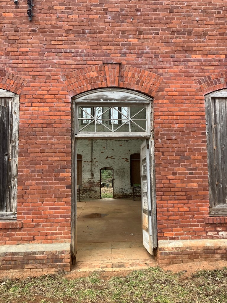 Open doorway with a transom window in the red brick Arc Building